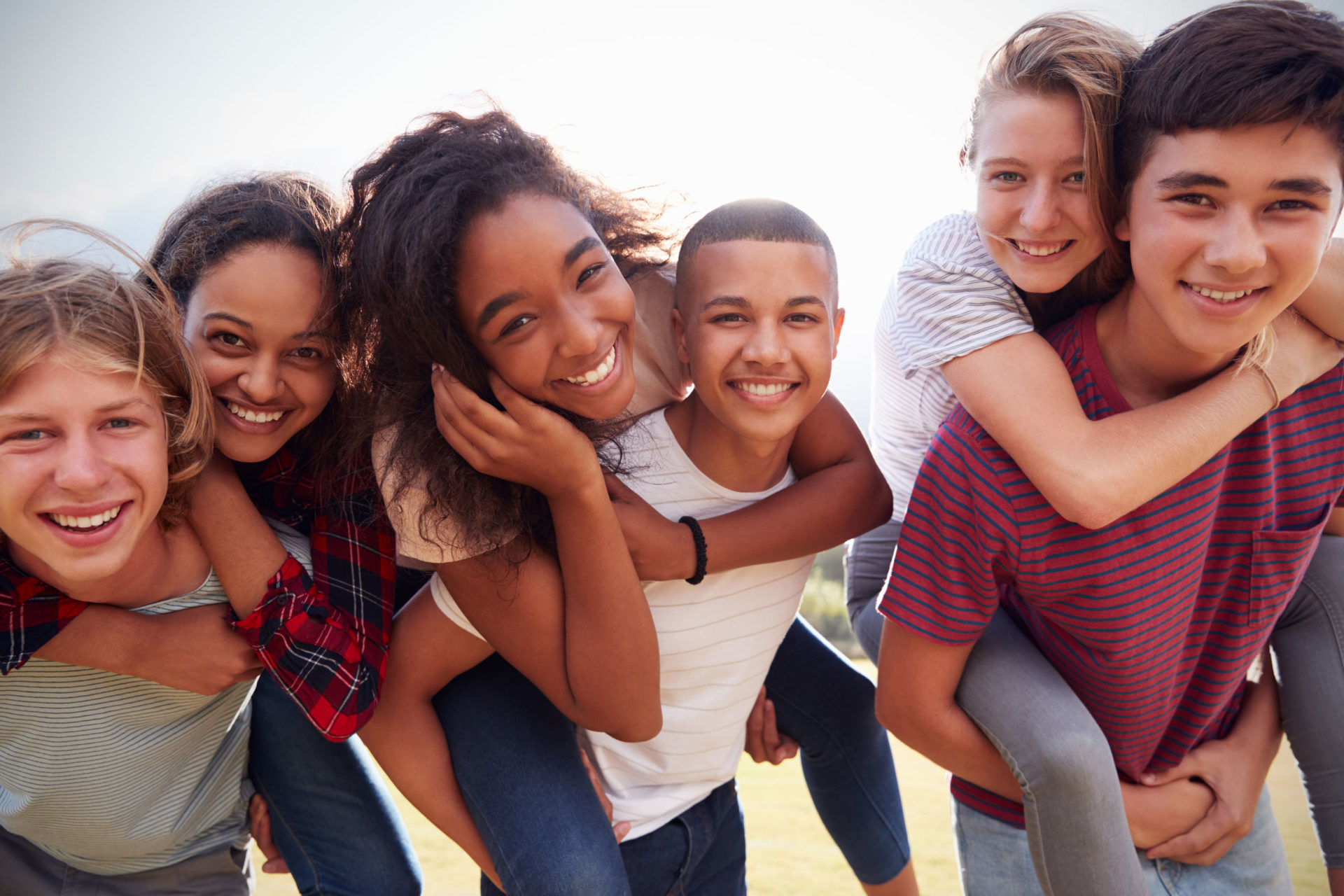 Group of teenagers smiling at camera