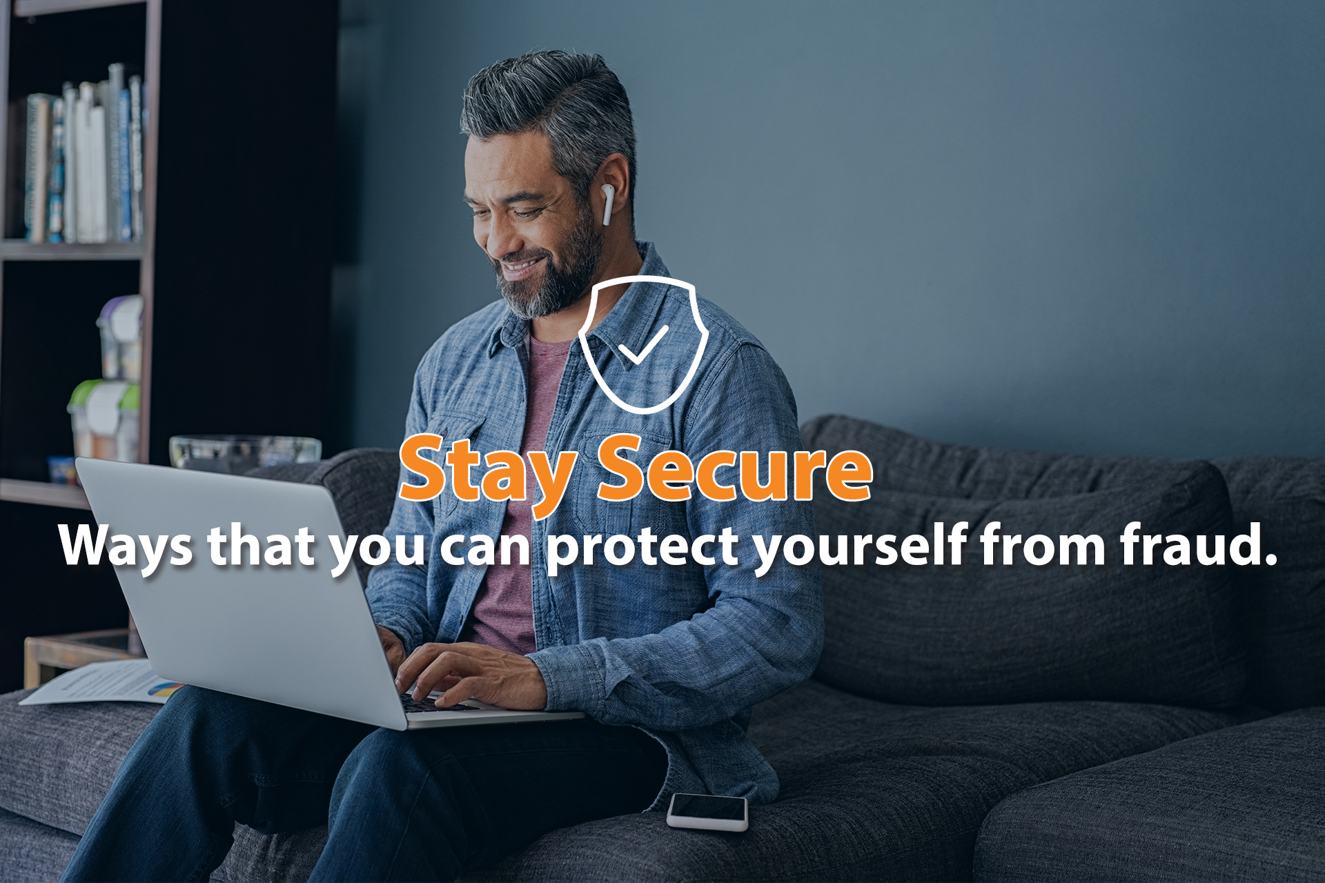 Man smiling while looking at laptop Man smiling while looking at laptop