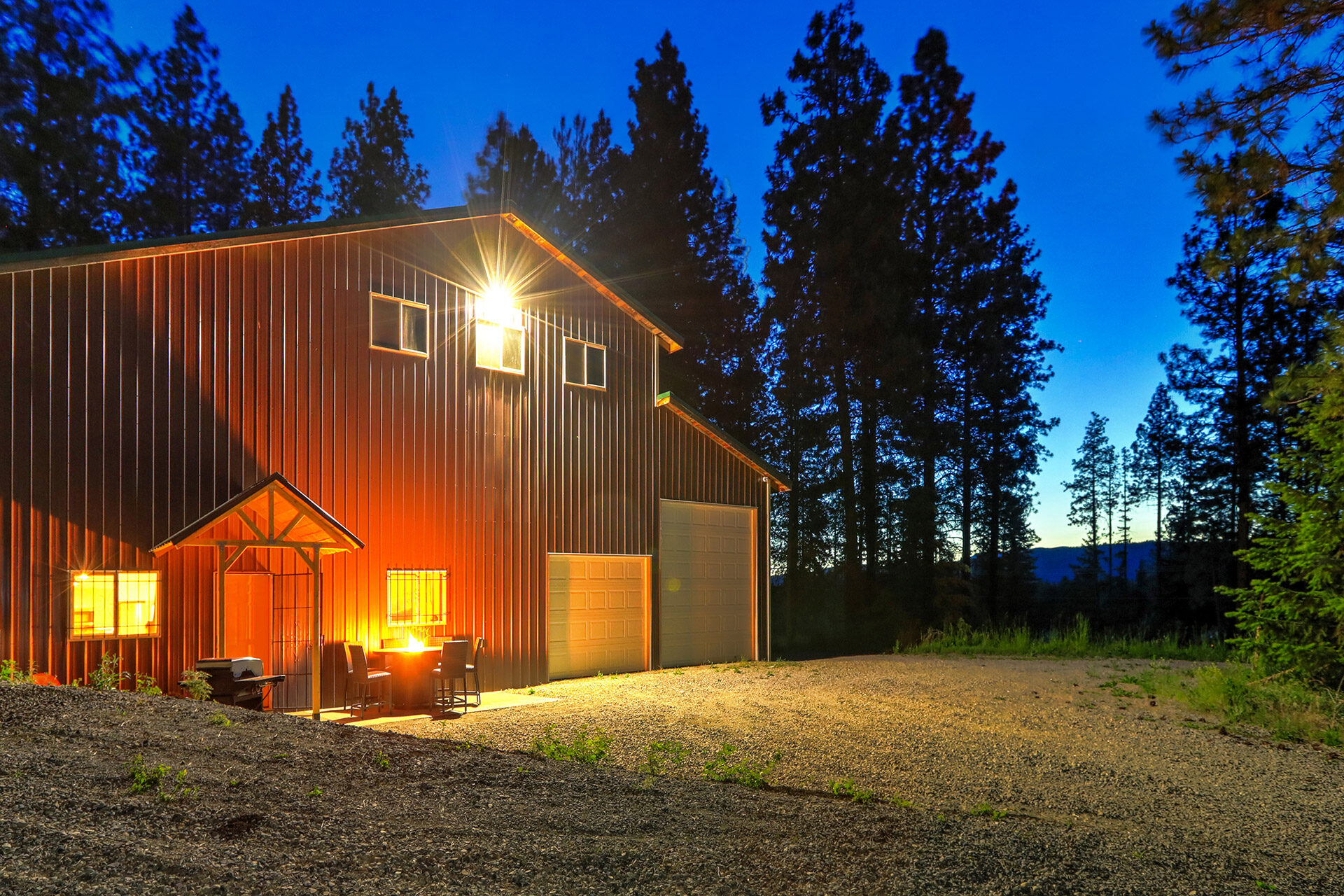 red barndominium in woods