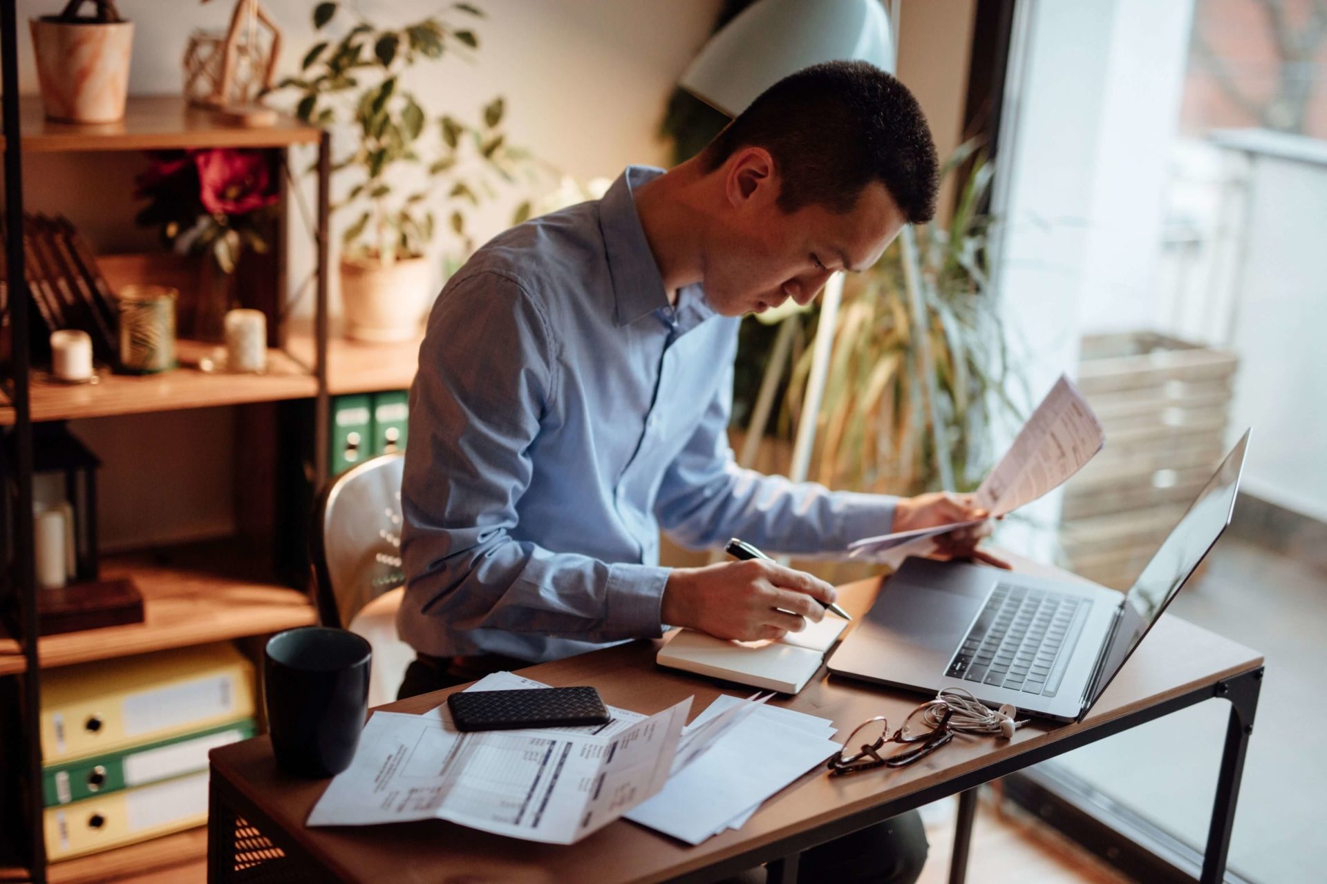 man going over paper work and bills